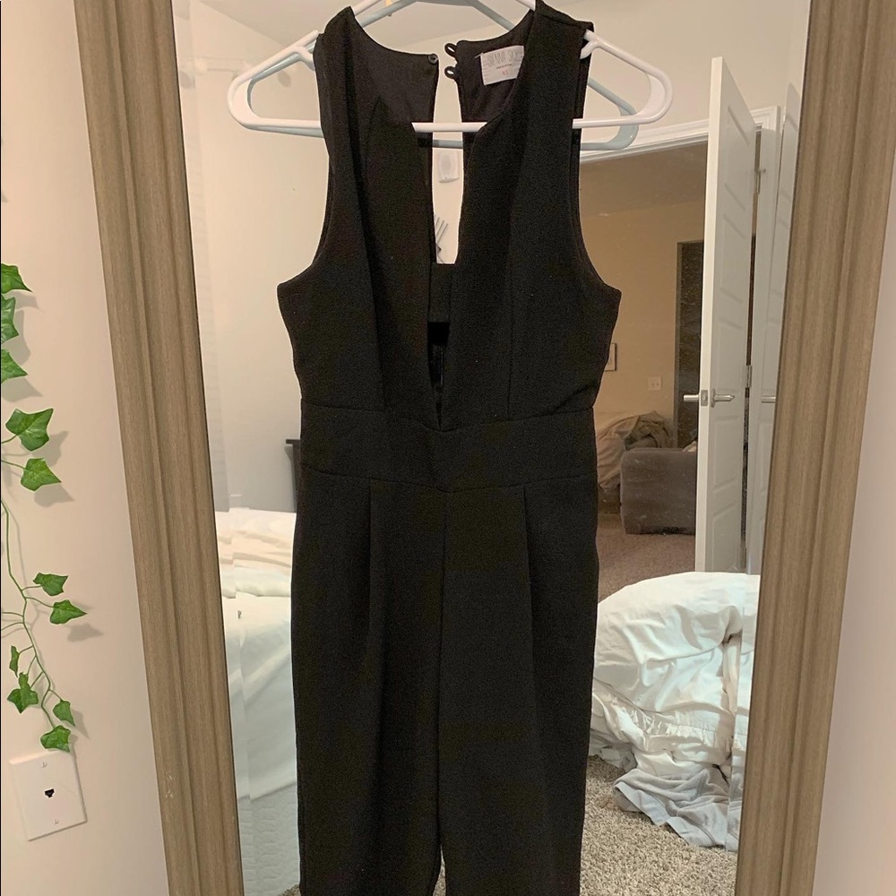 Formal Black Jumpsuit with cutout front.